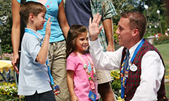 Boy high-fiving a Disney Cast Member